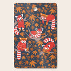 Red panda blending with the foliage // navy background red cozy animals fog brown taupe tree branches orange acer leaves Cutting Board Gallery Image 1