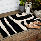 Mid Century Modern Kwaito Abstract Pattern in Black and Almond Cream Outdoor Rug Gallery Image 2