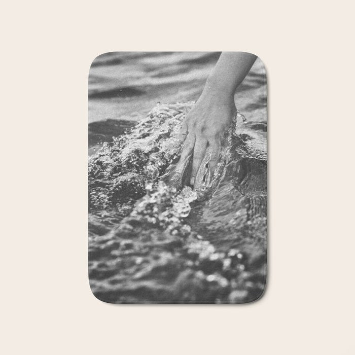 Running hand through the water, under the blue again black and white photograph / art photography Bath Mat Gallery Image 1