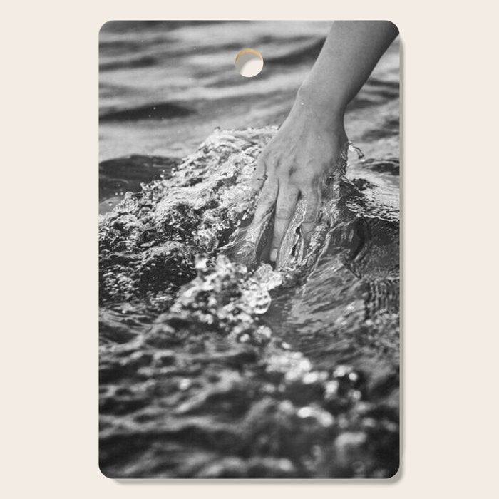 Running hand through the water, under the blue again black and white photograph / art photography Cutting Board Gallery Image 1