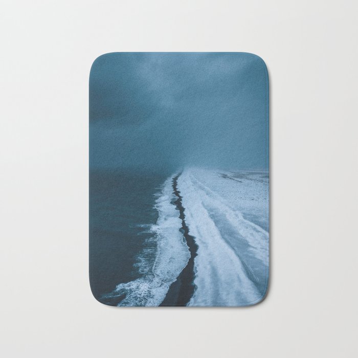 Black Sand Beach with snow in Iceland during a storm â Moody Landscape Photography Bath Mat Gallery Image 1