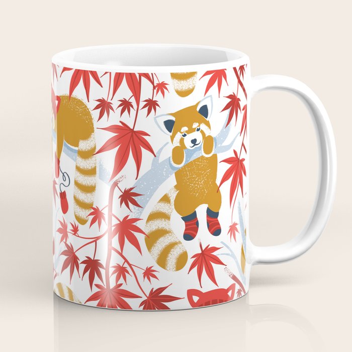 Red panda blending with the foliage // white background desert sun brown cozy animals fog blue tree branches red acer leaves Coffee Mug Gallery Image 1