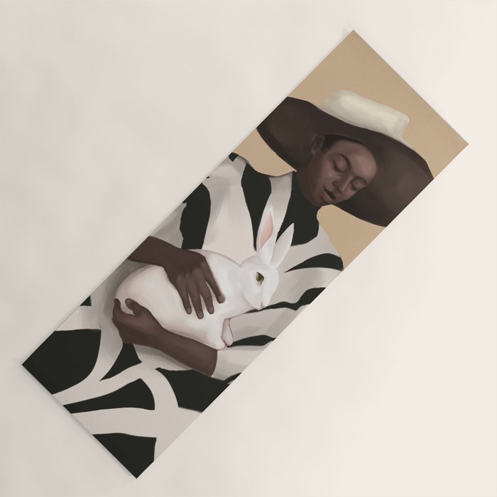 Woman in Stripes Holding a White Rabbit Yoga Mat Gallery Image 1