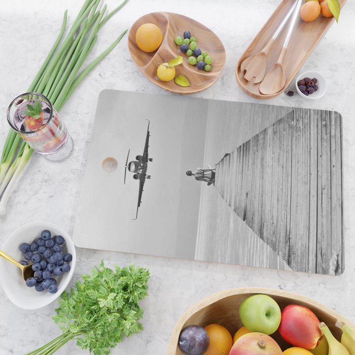 Steady As She Goes 6; aircraft coming in for an island landing female in bikini black and white photography - photographs - photograph Cutting Board Gallery Image 2