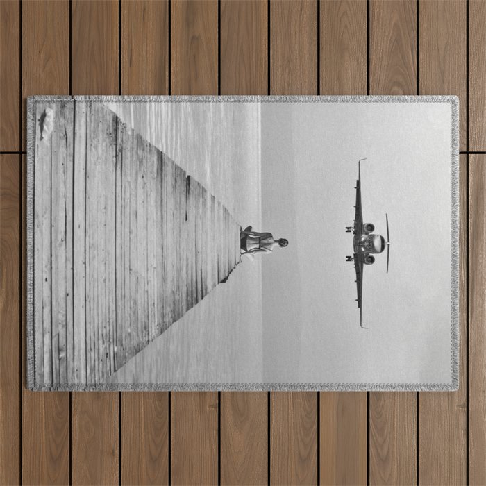 Steady As She Goes 6; aircraft coming in for an island landing female in bikini black and white photography - photographs - photograph Outdoor Rug Gallery Image 1
