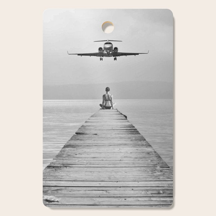 Steady As She Goes 6; aircraft coming in for an island landing female in bikini black and white photography - photographs - photograph Cutting Board Gallery Image 1