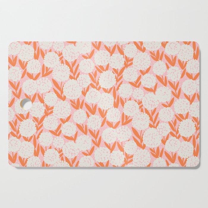 Blooming Abstract Cream and Orange Allium Flowers on Pastel Pink Cutting Board Gallery Image 1