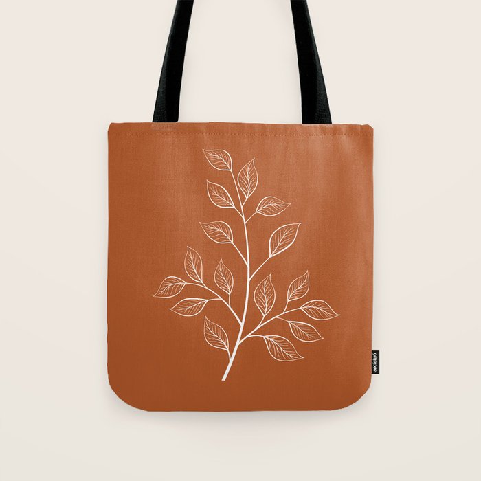 Delicate White Leaves and Branch on a Rust Orange Background Tote Bag Gallery Image 1