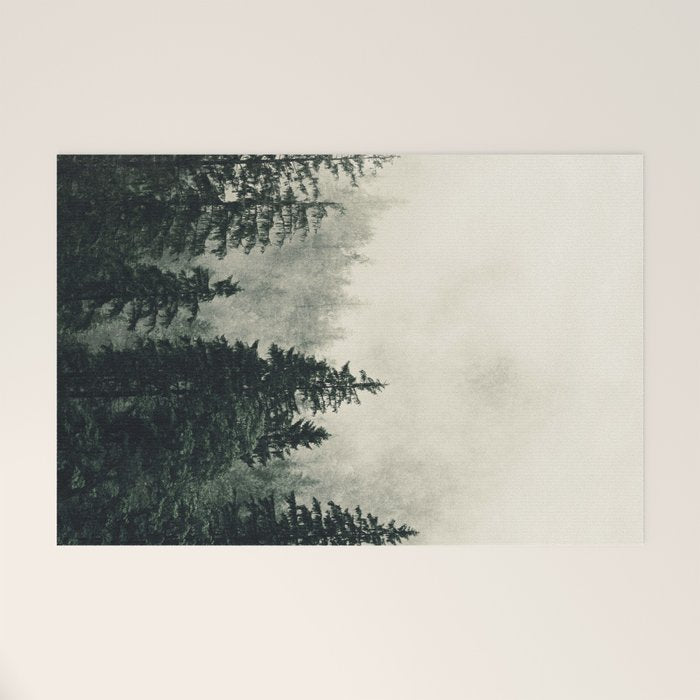 Thick pine forest in the descending mist Welcome Mat Gallery Image 1