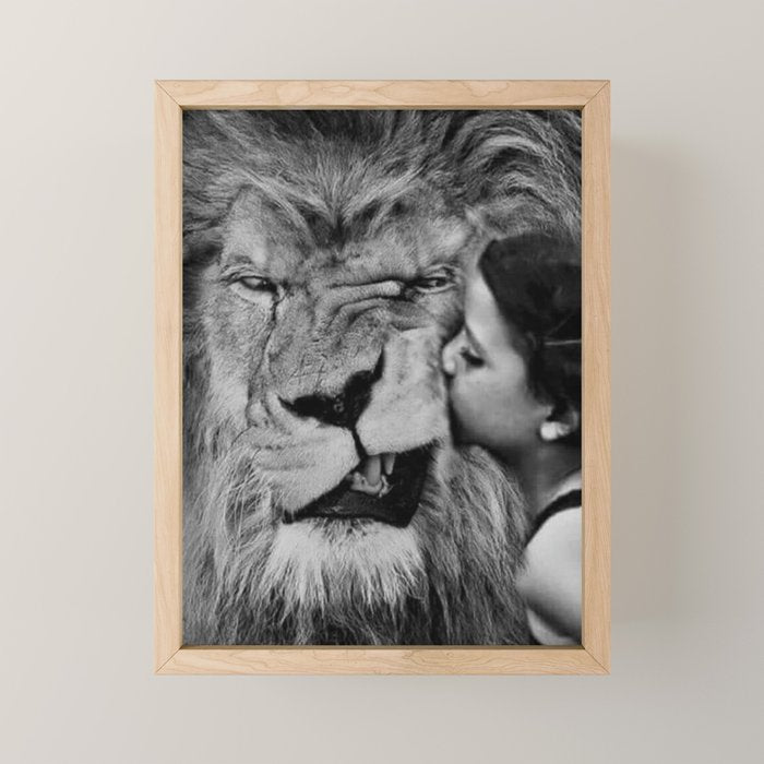 Grouchy Lion being kissed by brunette girl black and white photography Mini Art Print Gallery Image 1
