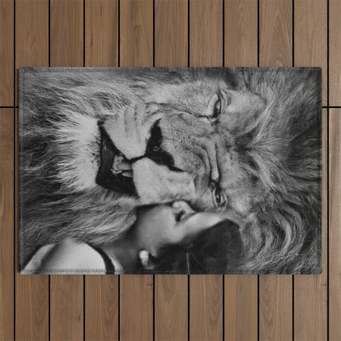 Grouchy Lion being kissed by brunette girl black and white photography Outdoor Rug Gallery Image 1