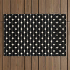 Mid Century Modern Atomic Stars and Dots Pattern in Black and Almond Cream Outdoor Rug Gallery Image 1