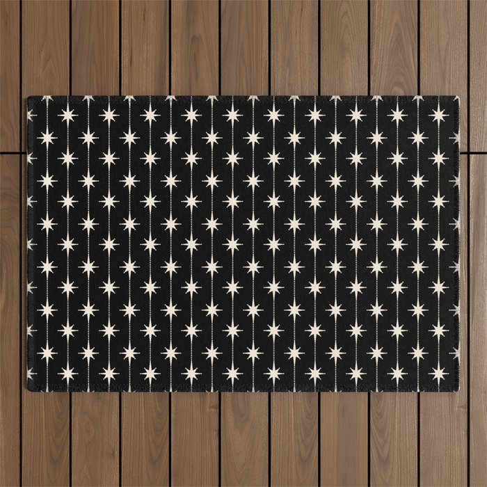 Mid Century Modern Atomic Stars and Dots Pattern in Black and Almond Cream Outdoor Rug Gallery Image 1