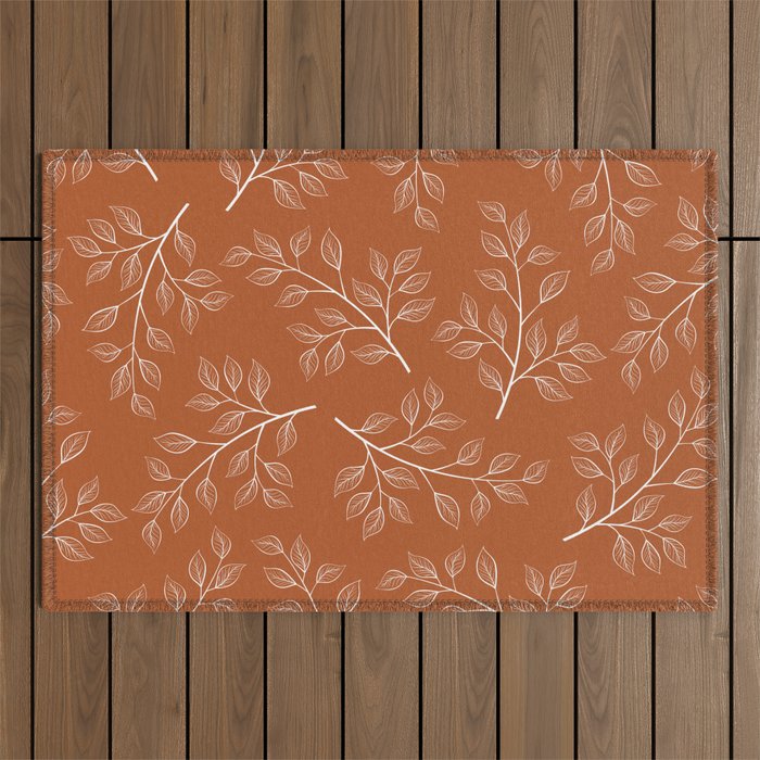 Delicate White Leaves and Branch on a Rust Orange Background Outdoor Rug Gallery Image 1