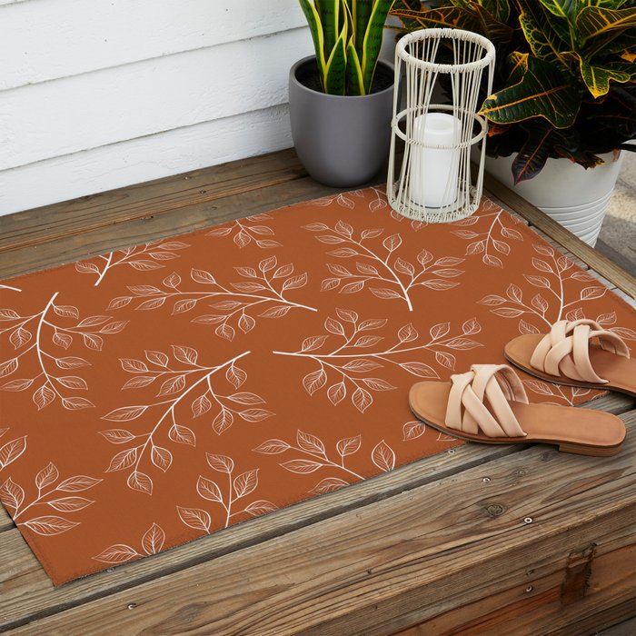 Delicate White Leaves and Branch on a Rust Orange Background Outdoor Rug Gallery Image 2
