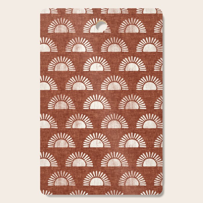 block print suns on rust Cutting Board Gallery Image 1