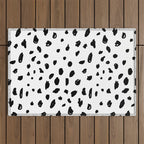 Black geometrical hand painted polka dots confetti pattern Outdoor Rug Gallery Image 1