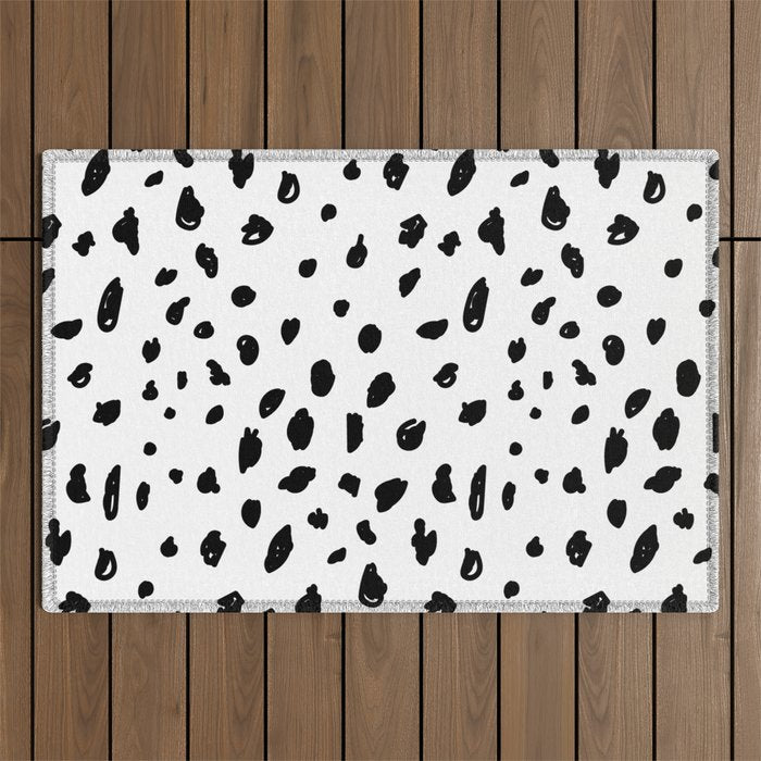 Black geometrical hand painted polka dots confetti pattern Outdoor Rug Gallery Image 1
