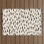 Organic Texture Minimalist Abstract Pattern in Black and Almond Cream Outdoor Rug Gallery Image 1
