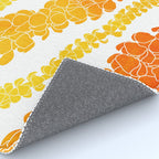 Puakenikeni lei art on white Rug Gallery Image 4