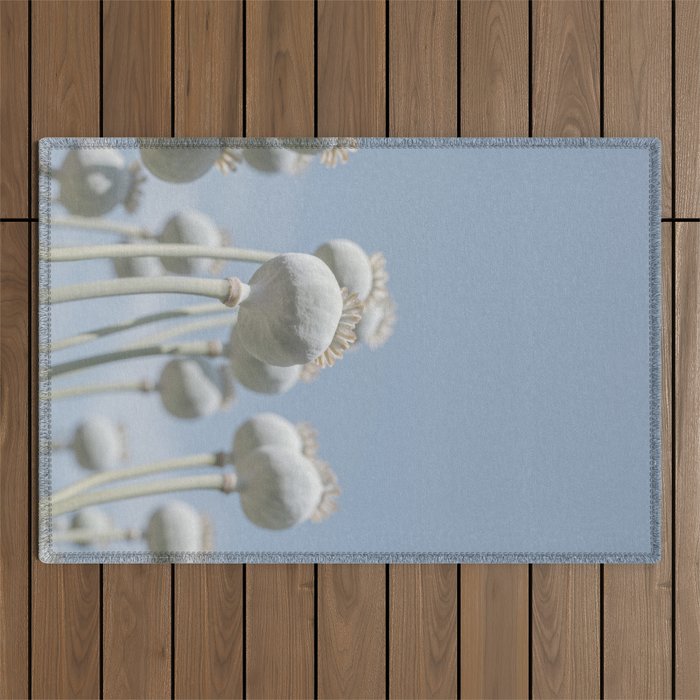 Nostalgic midtones poppy bulbs in a blue sky - retro style nature photography Outdoor Rug Gallery Image 1