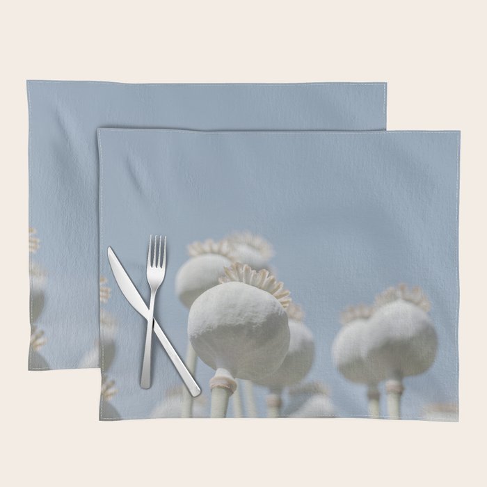 Nostalgic midtones poppy bulbs in a blue sky - retro style nature photography Placemat Gallery Image 1