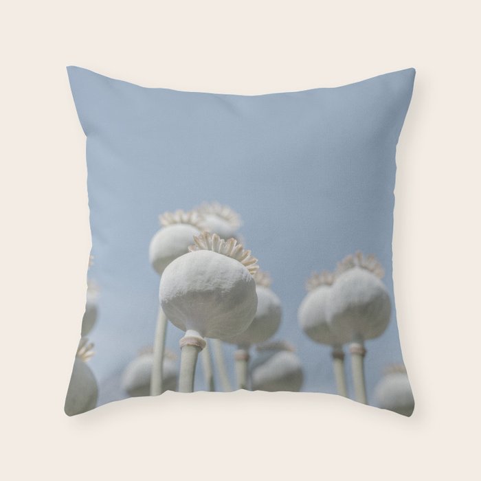 Nostalgic midtones poppy bulbs in a blue sky - retro style nature photography Throw Pillow Gallery Image 1