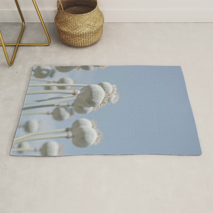 Nostalgic midtones poppy bulbs in a blue sky - retro style nature photography Rug Gallery Image 1