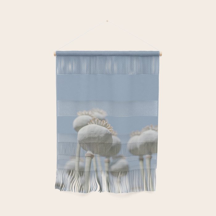 Nostalgic midtones poppy bulbs in a blue sky - retro style nature photography Wall Hanging Gallery Image 1
