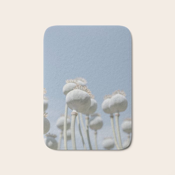 Nostalgic midtones poppy bulbs in a blue sky - retro style nature photography Bath Mat Gallery Image 1