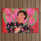 Portrait woman with tulips on red background Outdoor Rug Gallery Image 1