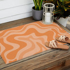 Retro Liquid Swirl Abstract Pattern in Muted Apricot Orange Outdoor Rug Gallery Image 2