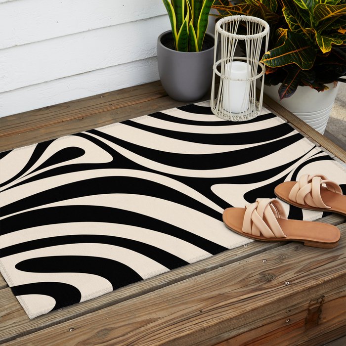 New Groove Retro Swirl Abstract Black and Almond Cream Outdoor Rug Gallery Image 2