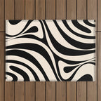 New Groove Retro Swirl Abstract Black and Almond Cream Outdoor Rug Gallery Image 1