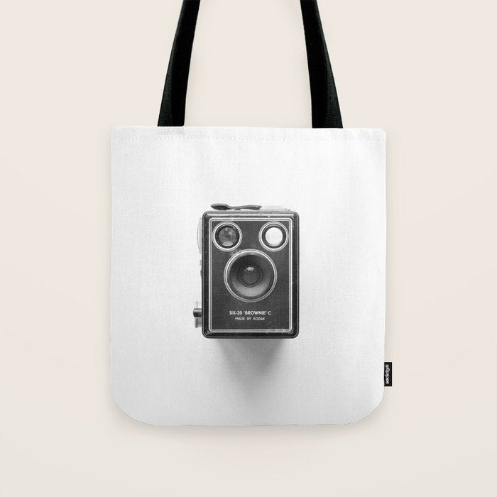 A Kodak Brownie analog vintage camera on a white background  Retro photography in black and white Tote Bag Gallery Image 1