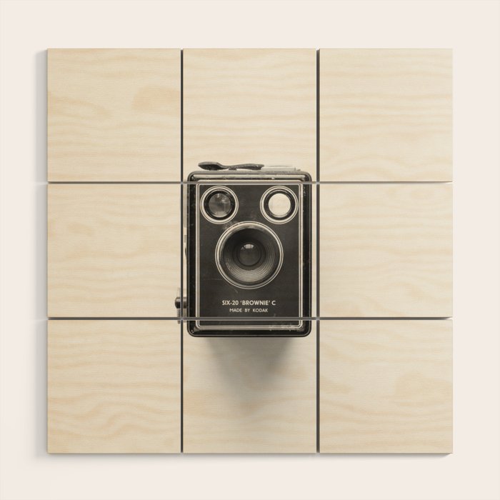 A Kodak Brownie analog vintage camera on a white background  Retro photography in black and white Wood Wall Art Gallery Image 1