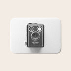 A Kodak Brownie analog vintage camera on a white background  Retro photography in black and white Bath Mat Gallery Image 1