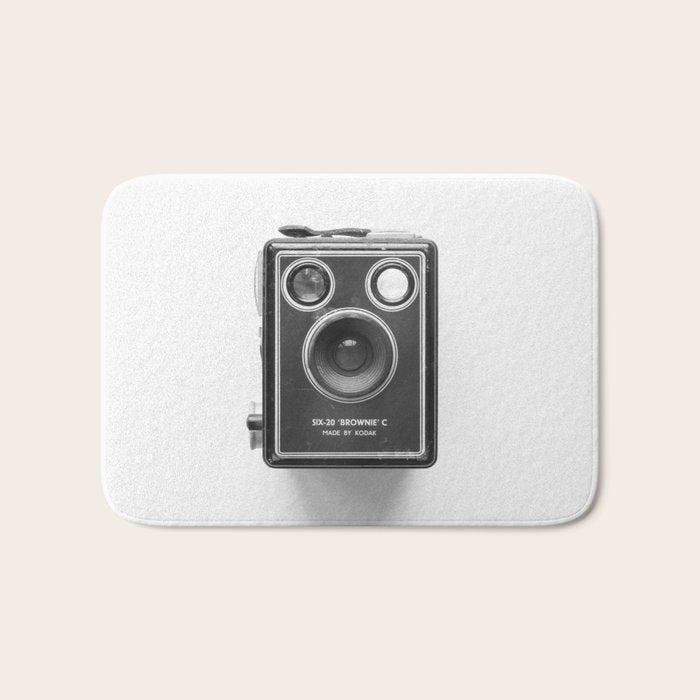 A Kodak Brownie analog vintage camera on a white background  Retro photography in black and white Bath Mat Gallery Image 1