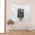 A Kodak Brownie analog vintage camera on a white background  Retro photography in black and white Wall Tapestry Gallery Image 2