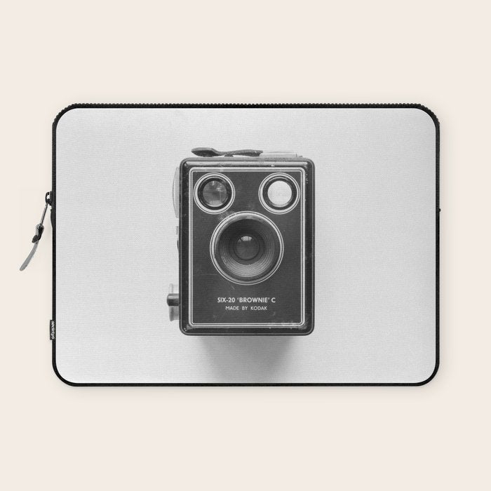 A Kodak Brownie analog vintage camera on a white background  Retro photography in black and white Laptop Sleeve Gallery Image 1