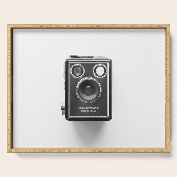 A Kodak Brownie analog vintage camera on a white background  Retro photography in black and white Serving Tray Gallery Image 1