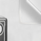 A Kodak Brownie analog vintage camera on a white background  Retro photography in black and white Wall Tapestry Gallery Image 3