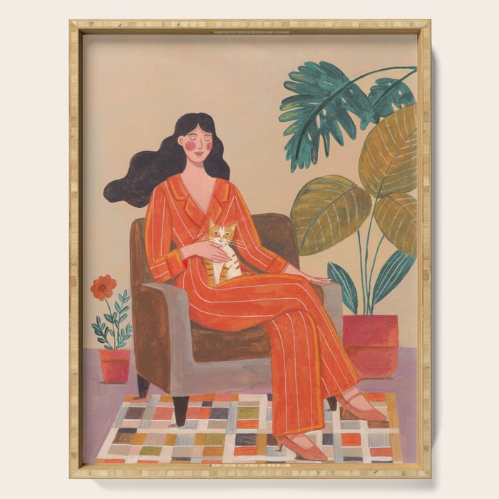 Woman with cat in living room in warm earth tones Serving Tray Gallery Image 1
