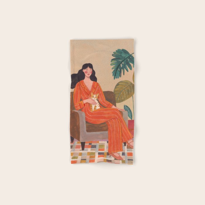 Woman with cat in living room in warm earth tones Bath Towel Gallery Image 1