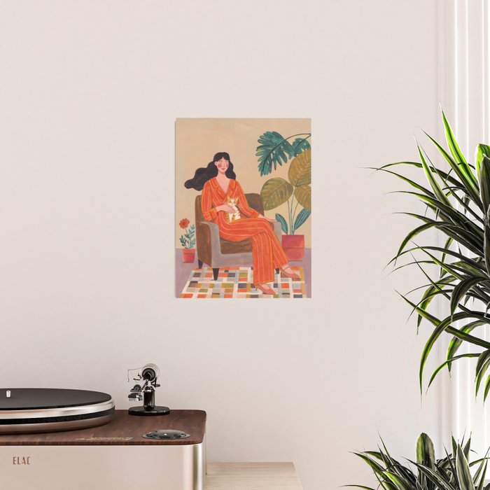 Woman with cat in living room in warm earth tones Poster Gallery Image 2