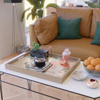 Woman with cat in living room in warm earth tones Serving Tray Gallery Image 2