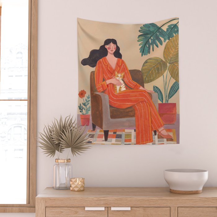 Woman with cat in living room in warm earth tones Wall Tapestry Gallery Image 2