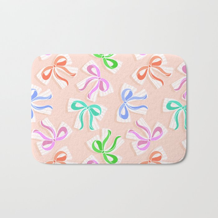 Ditsy Kitsch Ribbons and bows 1. Pastel Rainbow colours on Peach Bath Mat Gallery Image 1