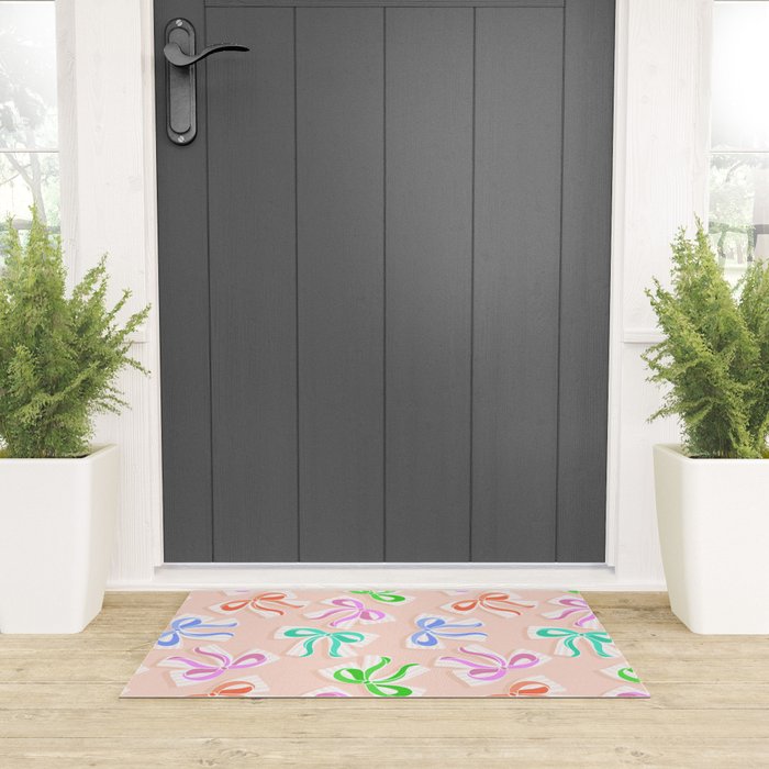 Ditsy Kitsch Ribbons and bows 1. Pastel Rainbow colours on Peach Welcome Mat Gallery Image 3