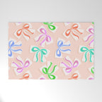Ditsy Kitsch Ribbons and bows 1. Pastel Rainbow colours on Peach Welcome Mat Gallery Image 1